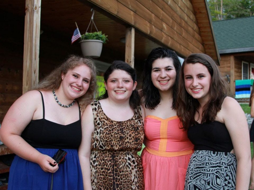 A group of campers is ready to go to the dance.