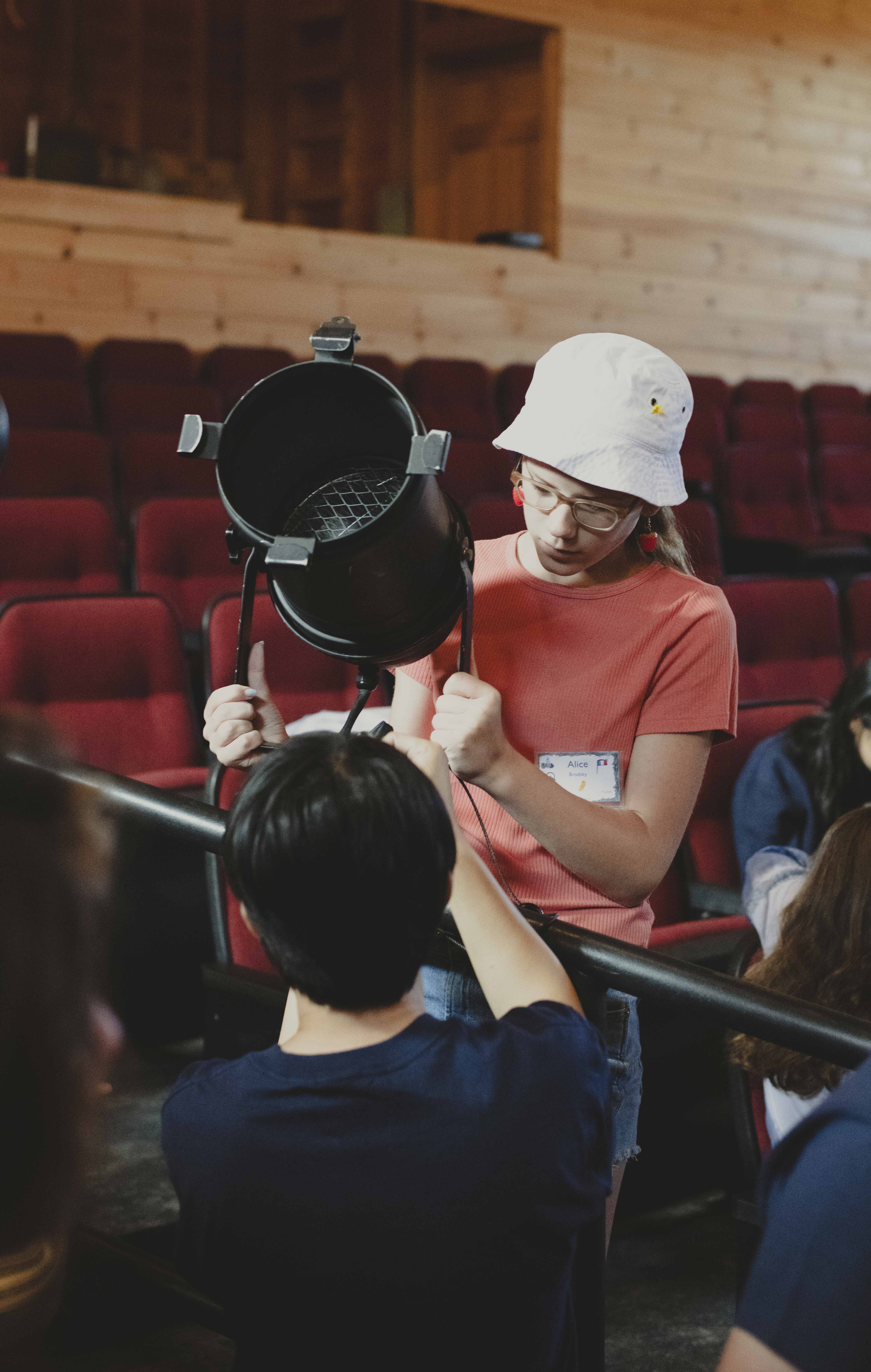 Summer Camp Attendees Adjusting Lighting Rig